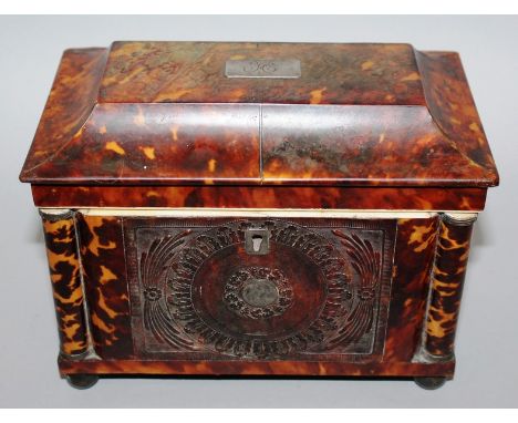 A GOOD REGENCY TORTOISESHELL TWO DIVISION TEA CADDY with embossed front on four ball feet 7.5ins wide.