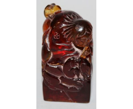 A CHINESE AMBER SEAL 2.5ins high.