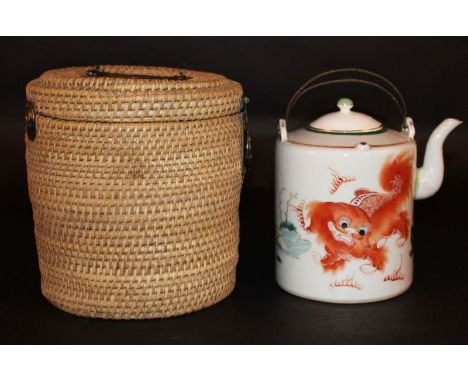 A CHINESE PORCELAIN TEAPOT, circa 1900, with matched cover and with fitted wicker work container, the sides of the cylindrica