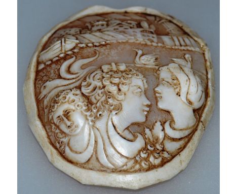 AN ENGRAVED AND CARVED MOTHER-OF-PEARL SHELL with three girls, ducks, a boat and building 4ins x 3.25ins.
