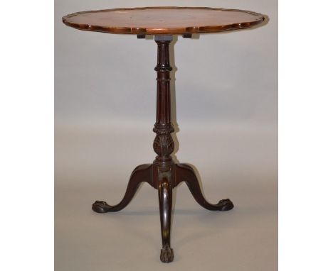 A CHIPPENDALE MAHOGANY PIECRUST TABLE on tripod supports 2ft 3ins high.