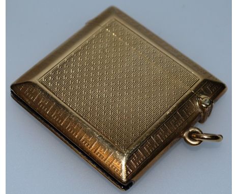 A GEORGE V 9CT GOLD ENGINE TURNED VESTA. Engraved Nov. 18th 1928. Birmingham 1928 Approx. 27gms.
