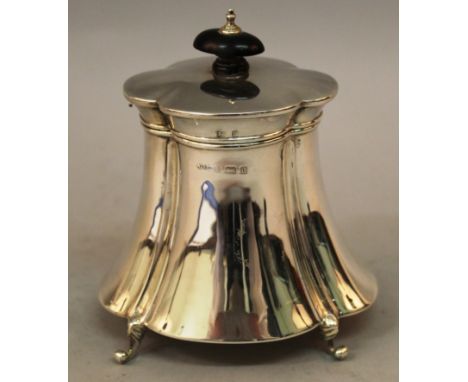AN EDWARD VII SHAPED TEA CADDY AND COVER on four curving legs Birmingham 1901.