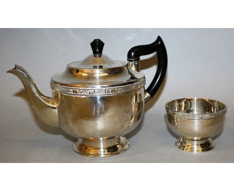 AN ALPHA PLATE CIRCULAR TEAPOT AND SUGAR BASIN.