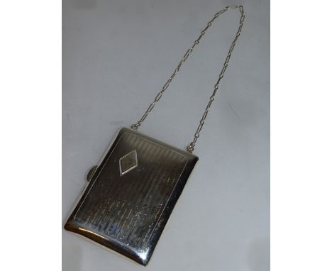 A STERLING SILVER PURSE AND CHAIN with sovereign and half sovereign, compartment and clip for calling card.