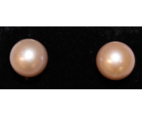 A LARGE PAIR OF SOUTH SEA NATURAL PINK PEARL EARRINGS.