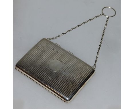 A GEORGE V ENGRAVED SILVER PURSE ON CHAIN. Birmingham 1910.