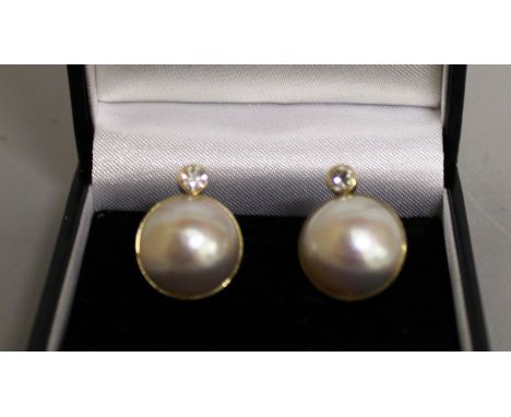 A LARGE PAIR OF PEARL AND DIAMOND EARRINGS set in yellow gold.