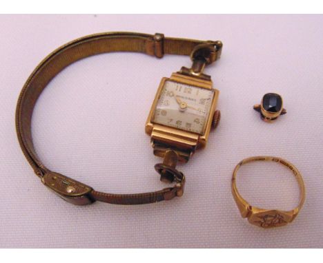 9ct gold ladies wristwatch, a 9ct gold signet ring and a sapphire set in 9ct gold