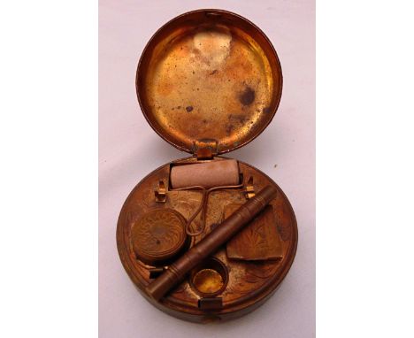 A late 19th century leather bound and metal travelling stationery set to include a roller, an inkwell, a stamp box and a penc