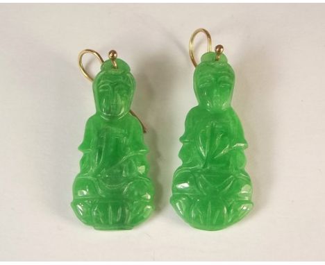 JADE EARRINGS.
A pair of oriental, apple green carved jade earrings, mounted with hand made 9ct. gold hooks.