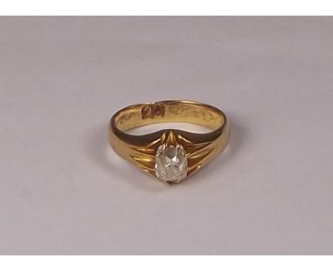 DIAMOND RING.
A 22ct. gold ring, set a cushion shaped old cut diamond of slightly tinted colour. Approx. 1ct.