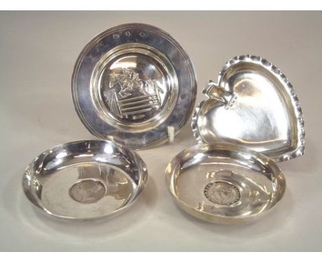 SILVER DISHES.
A modern silver dish by Garrard, embossed with a show jumper, a heart shaped silver pin tray, Birmingham 1919 