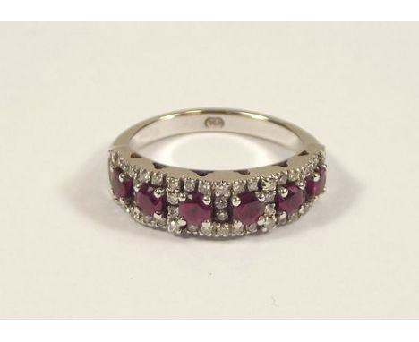 RUBY & DIAMOND RING.
An 18ct. white gold, half hoop ruby & diamond ring.