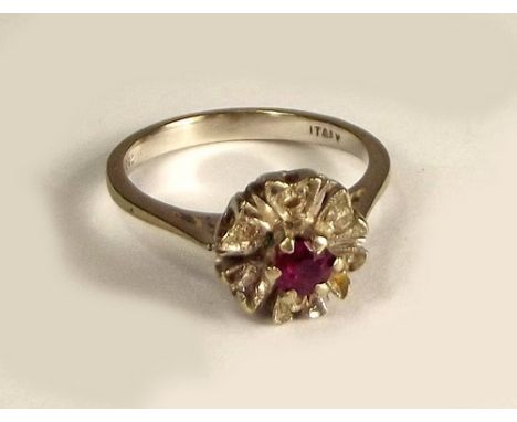 RUBY RING.
An 18ct. white gold, ruby & illusion set diamond ring.