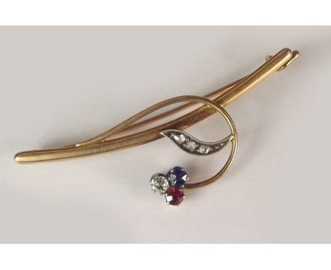 RUSSIAN BROOCH.
A Russian gold bar brooch, set with diamonds, a ruby & sapphire. Stamped 56 AP. Original fitted box T & I. Pe