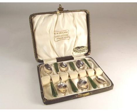 TEASPOONS.
A set of six sterling silver teaspoons, with New Zealand green stone handles, cased.