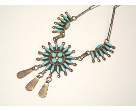 NORTH AMERICAN SILVER.
A North American silver & turquoise necklace of needlepoint design. Signed Zuni, Sterling.