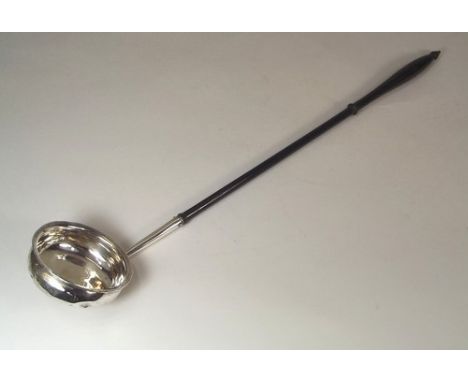 TODDY LADLE.
A 19th century silver toddy ladle with turned ebony handle.