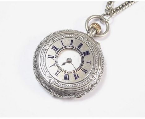 SILVER FOB WATCH.
A silver half hunter fob watch on white metal chain.