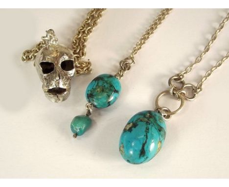 COSTUME JEWELLERY.
Two turquoise drop pendants on silver chains & a white metal skull pendant.