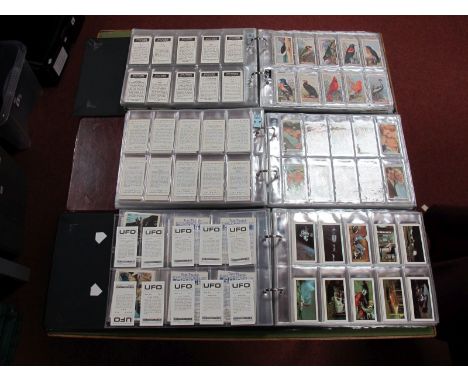 Thematic Cigarette and Non Tobacco Trade Cards in Three Well Filled Albums. Themes covered are entertainment, space and wildl