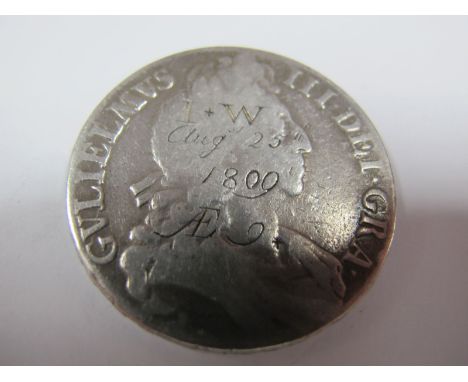 A Low Grade William III Crown, inscribed on its reverse "J. W. born August 25th 1800, The Gift of His Grandmother E. W". Inte