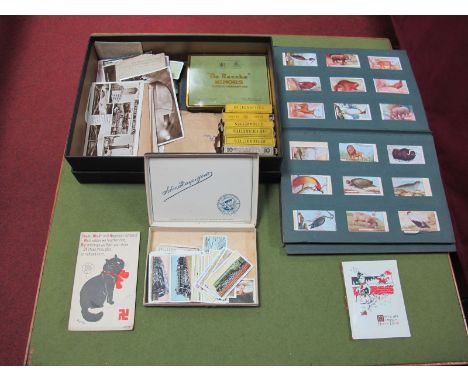 An Assortment of Cigarette Cards, regularly by the major manufacturers. In an album and with loose. A smaller number of postc