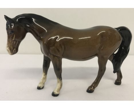 A Beswick ceramic Pony figurine (Boy's Pony) #1480, in brown colourway. With gloss finish and oval back stamp. Designed by Ar