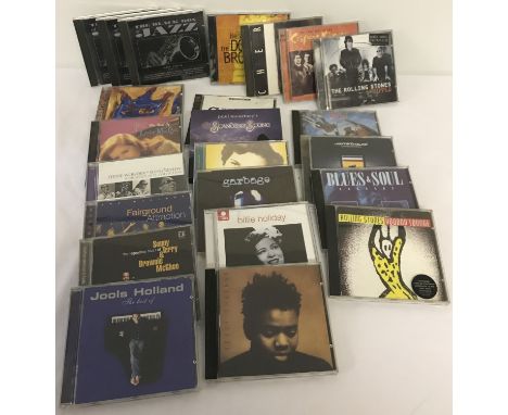 A collection of 23 blues, jazz, rock and popular music cd's. To include Rolling Stones, Paul McCartney, Jools Holland, Meat L