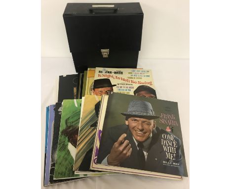 A vintage black record case containing 30 assorted Frank Sinatra vinyl records.  