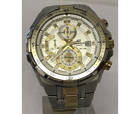 A men's "Ediface" chronograph wrist watch by Casio. Silver and gold tone bracelet. White and gold face with seconds hand and 