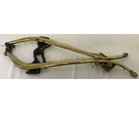 A pair of vintage brass hams. Marked "Double cased, solid brass, No 3". Approx. 85cm long.