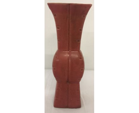 A Chinese red glaze ceramic vase with signature to underside.  Approx. 18cm tall.