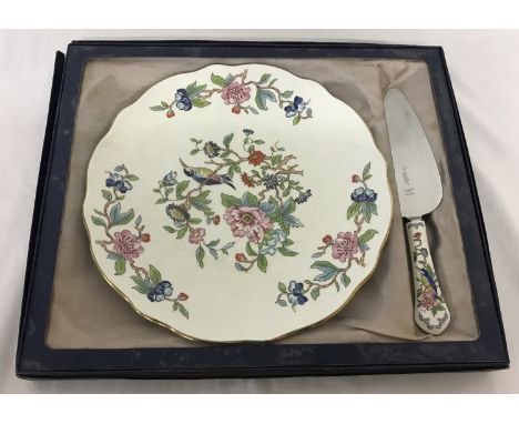 A ceramic Aynsley cake plate and knife with floral decoration. Matching items contained in original box. 