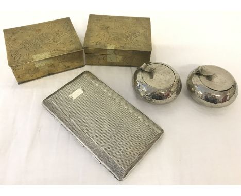 A silver plated cigarette case with blank cartouche. Together with 2 round silver plated snuff boxes and 2 brass trinket boxe