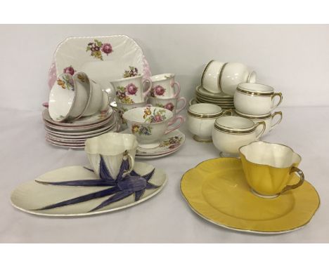 A collection of vintage Shelley tea ware. To include 2 part tea sets; one floral set of 3 teacups, 4 coffee cups, 7 saucers, 