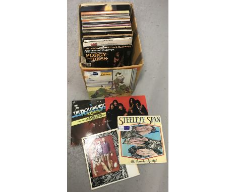 A box of assorted vintage vinyl LP's. To include: The Beach Boys, The Rolling Stones, Emerson Lake &amp; Palmer and Moms Mabl