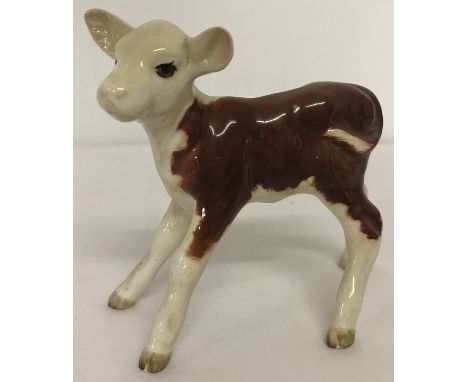 A ceramic Beswick figurine of a Hereford calf, Model #901b.  Approx. 9.5cm tall.