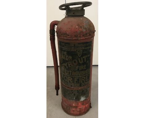 A vintage red Valor "Fyrout" extinguisher, with original hose attachment.  Approx. 50cm tall.