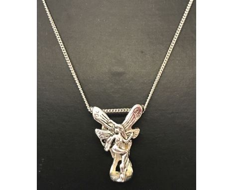 An Art Nouveau style, 3 dimensional fairy pendant on a silver 18" fine curb chain. Indistinct silver marks to bottom, words "