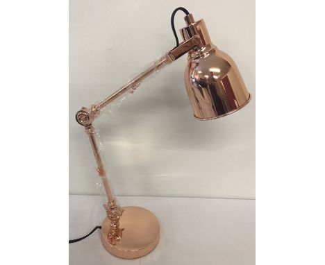 A new and boxed copper angle poise style desk lamp.  Shade approx. 11cm diameter.