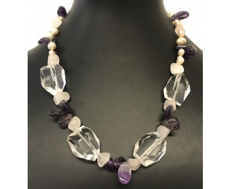A decorative amethyst, rose quartz, clear quartz and freshwater pearl necklace with t bar clasp.  Total length approx. 16 inc