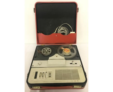 A vintage GEC portable reel to reel player/recorder in red carry case. Complete with reels, original power lead and microphon