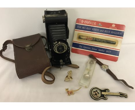 A mixed collection of vintage items. To include a Kodak Folding Brownie; a Services Sports watch; a Parker Jubilee 1977 Ball 