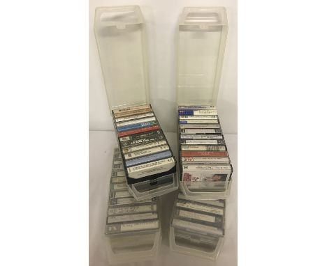 4 clear plastic vintage cases containing a total of 48 assorted cassette tapes.  