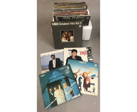 A collection of 50+ mixed genre LP and 12 inch records. Covers and sleeves in varying conditions. Bands and artists include: 