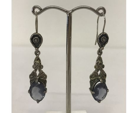 A pair of white metal vintage style drop earrings set with large blue stones and marcasite's. Blue stones approx. 12mm x 9mm.
