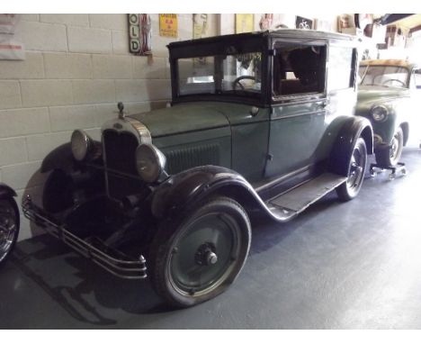 A 1927 left hand drive Chevrolet Capitol AA two door Sedan, chassis number 3348582, green over black. Chevrolet's Capitol ser