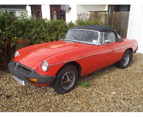 A 1978 MG B roadster, registration number ESU 893T, chassis number GHN5-475738G, Vermillion red. This rubber bumper roadster 